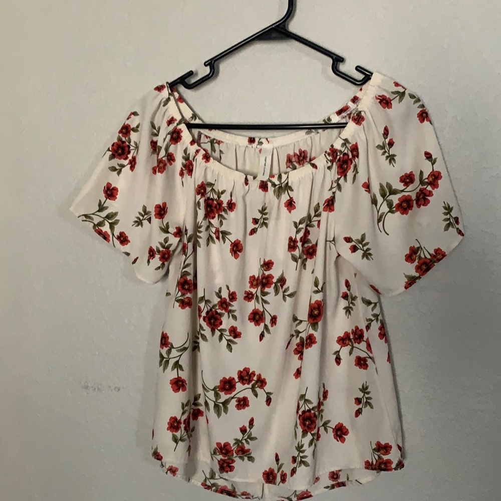 Off the shoulder cream and floral blouse